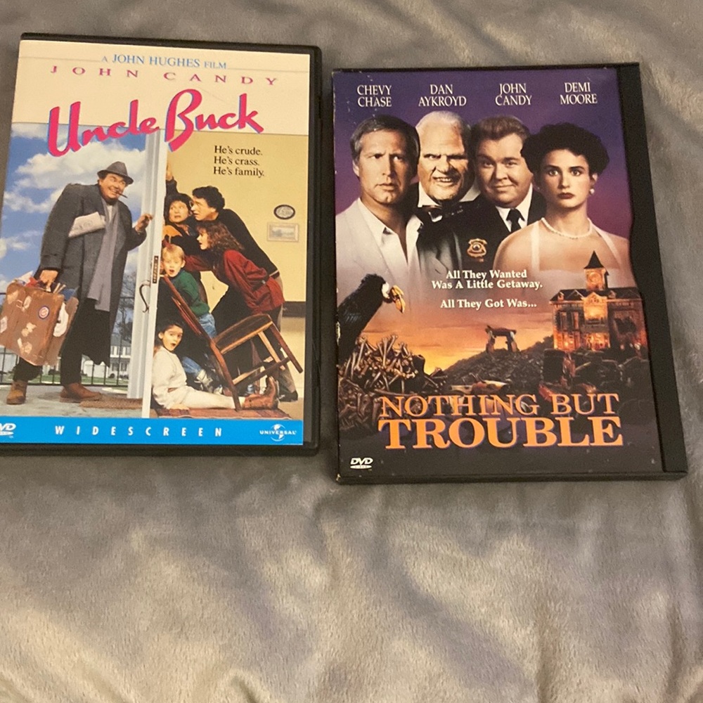 Set of two DVDs, starring John Candy, Nothing but Trouble and Uncle Buck